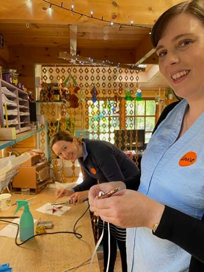 Participants enjoying a stain glass workshop