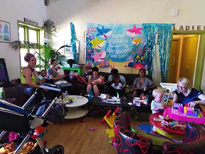 Parents and babies gathered at a drop-in