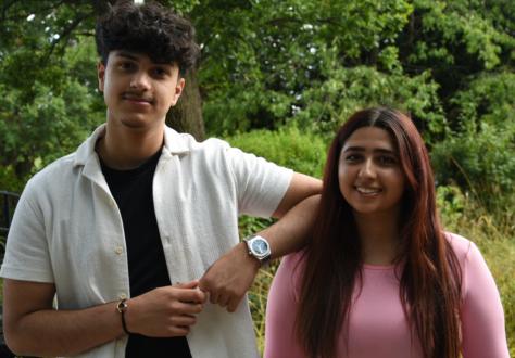 Teenage boy and girl standing next to eachother