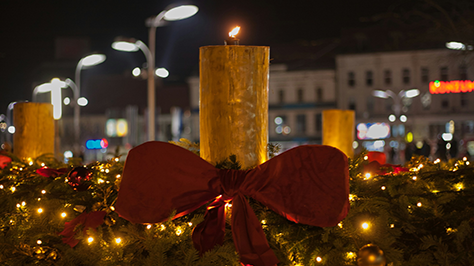 A lit candle to celebrate Christmas