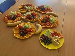 A selection of fruits on plates on a table