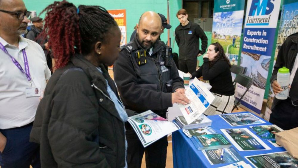 Police officer discussing job prospect 