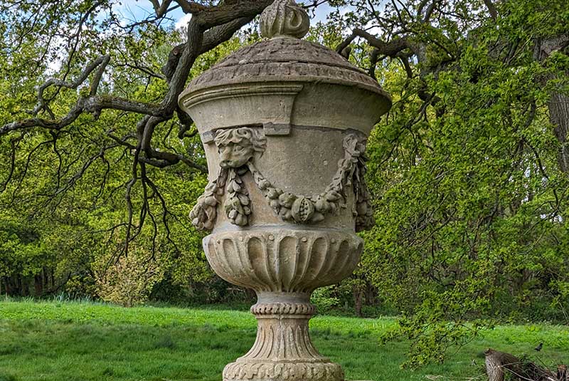 Urn statue in garden