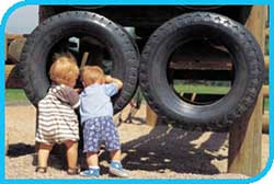2 young children with tyres