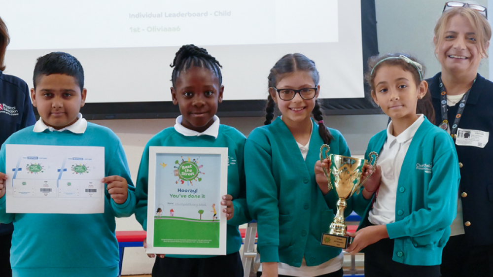 Children holding a trophy